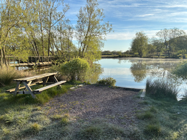 Picnic table by lake